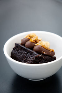 Chocolate brownie with velvety ganache and crunchy peanuts. perfect for food and dessert projects.