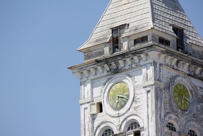 Low angle view of clock tower against sky