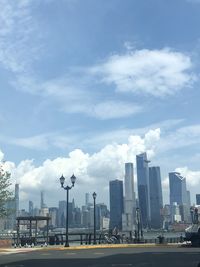 Modern buildings in city against sky