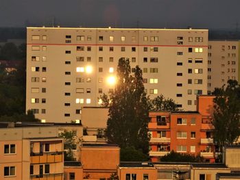 Buildings against sky at night