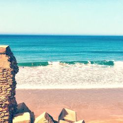 Scenic view of beach against clear sky