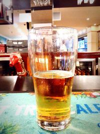 Close-up of beer in glass on table