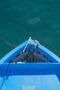 High angle view of blue boat in sea at harbor