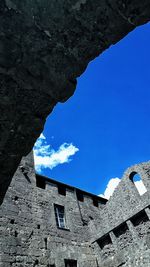 Buildings against blue sky and clouds