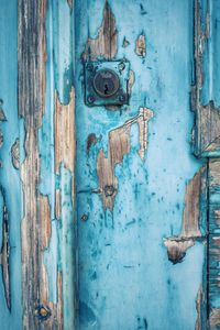 Full frame shot of weathered blue door