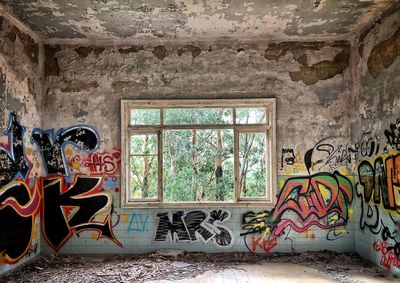 Graffiti on wall of abandoned building