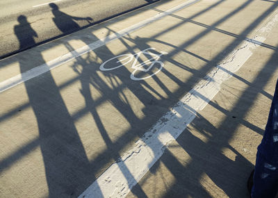 High angle view of shadow on street during sunny day