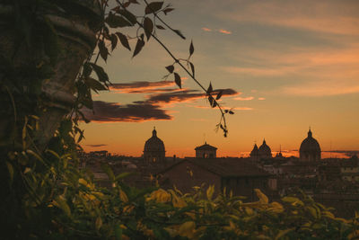 Buildings against sky during sunset