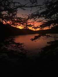 Scenic view of lake against orange sky