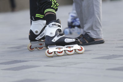 Low section of people standing in city