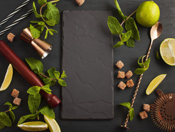 High angle view of fruits and leaves on table