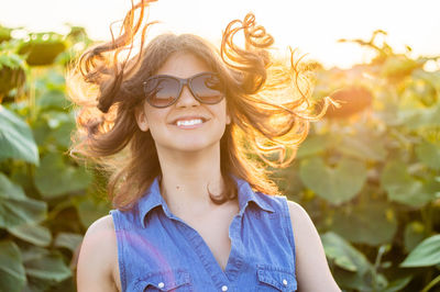 Young woman in sunflower farm