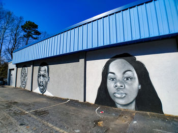 Graffiti on wall against clear sky