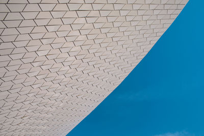 Low angle view of swimming pool against clear blue sky
