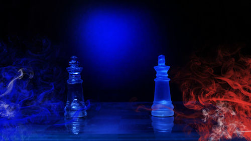 Close-up of illuminated chess pieces