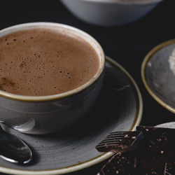 Close-up of coffee cup on table