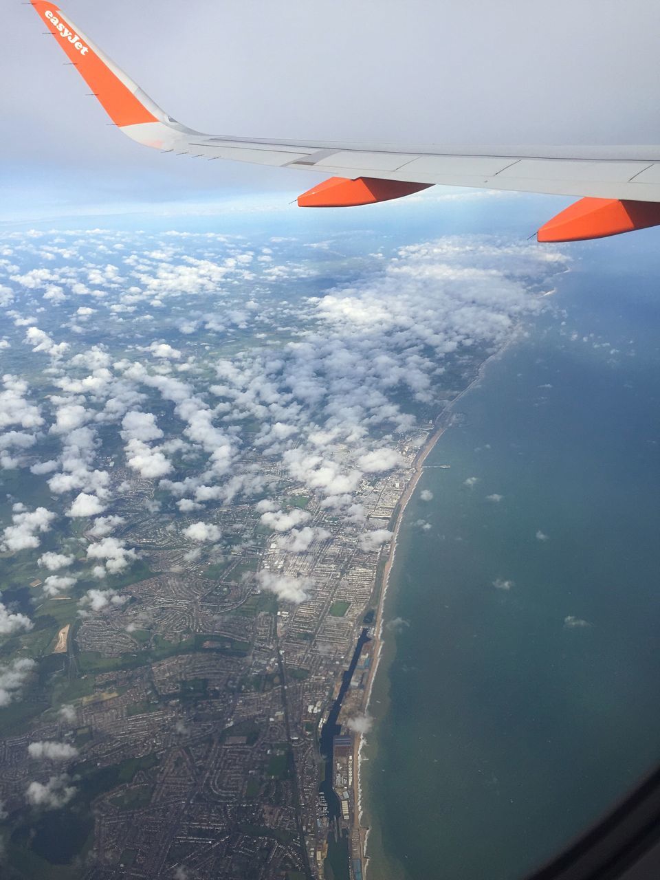 flying, air vehicle, aircraft wing, transportation, airplane, mode of transport, mid-air, sky, part of, aerial view, scenics, cropped, mountain, beauty in nature, landscape, travel, nature, tranquil scene, tranquility, day