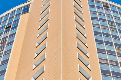 Multistorey building. rhythm in photography. multi-storey facade, windows, block of flats close up