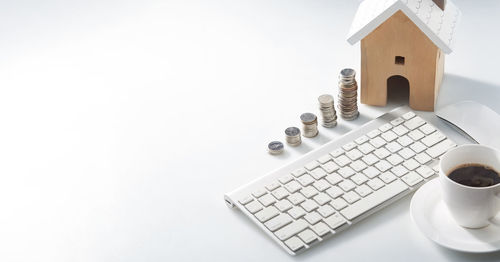 High angle view of laptop on table against white background