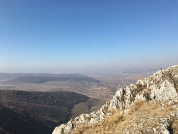 Scenic view of mountains against clear blue sky