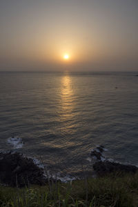 Scenic view of sea against sky during sunset