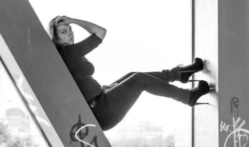 Young woman sitting outdoors