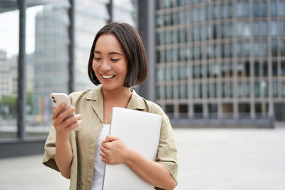 Young woman using mobile phone