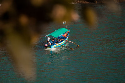 High angle view of people in boat on lake