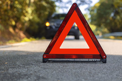 Close-up of stop sign on road