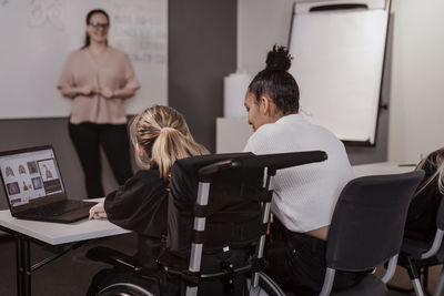 Girl on wheelchair in classroom