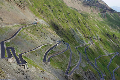 High angle view of winding road on land