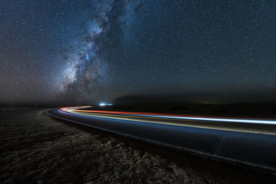 High angle view of light trails on road at night