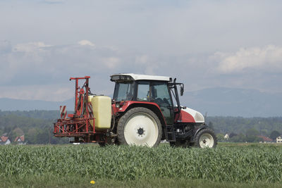 Tractor on field against sky