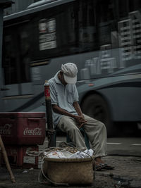 Rear view of woman working at bus