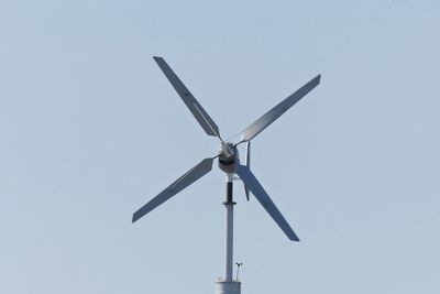 Low angle view of windmill against clear sky