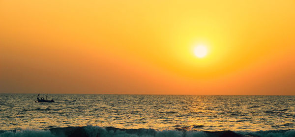 Scenic view of sea at sunset