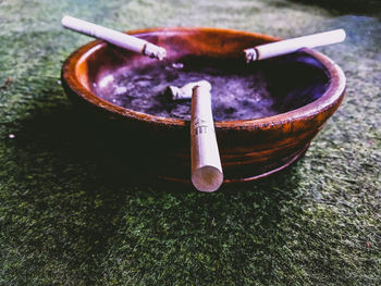High angle view of cigarette on table