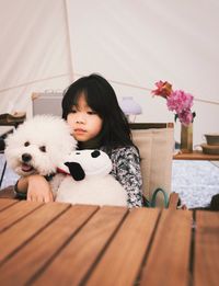 Portrait of cute girl with dog
