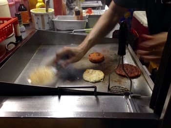 Midsection of man preparing food