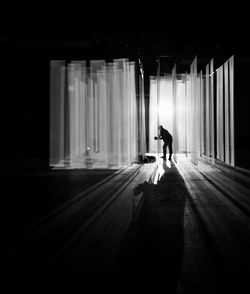 Full length of woman standing on wall
