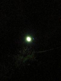 Low angle view of moon against sky at night