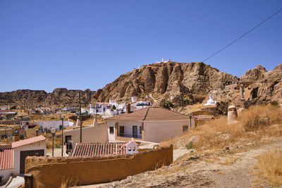 Panoramic view of townscape against clear blue sky