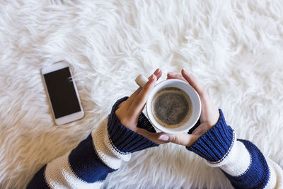 High angle view of coffee cup on table