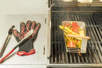 High angle view of meat on barbecue grill