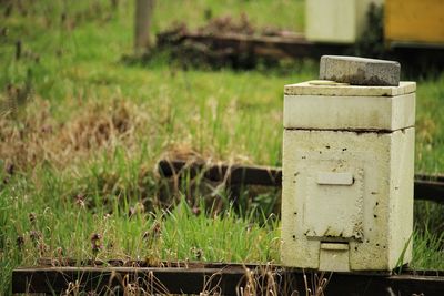 Close-up of rusty metal fence on field