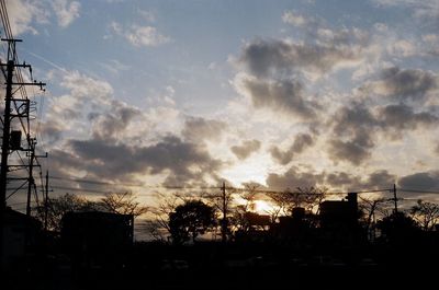 Silhouette trees against sky during sunset