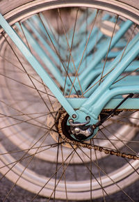 Close-up of bicycle wheel on sidewalk