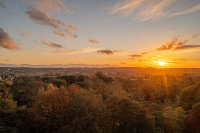 Scenic view of land against sky during sunset