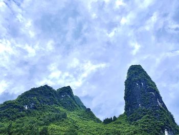 Low angle view of rocks against sky