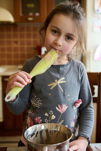 Midsection of woman holding ice cream